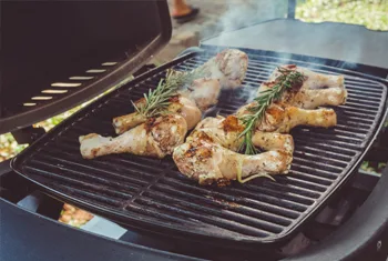 Family Using Outdoor Electric Grill - Weekend Backyard BBQ Party